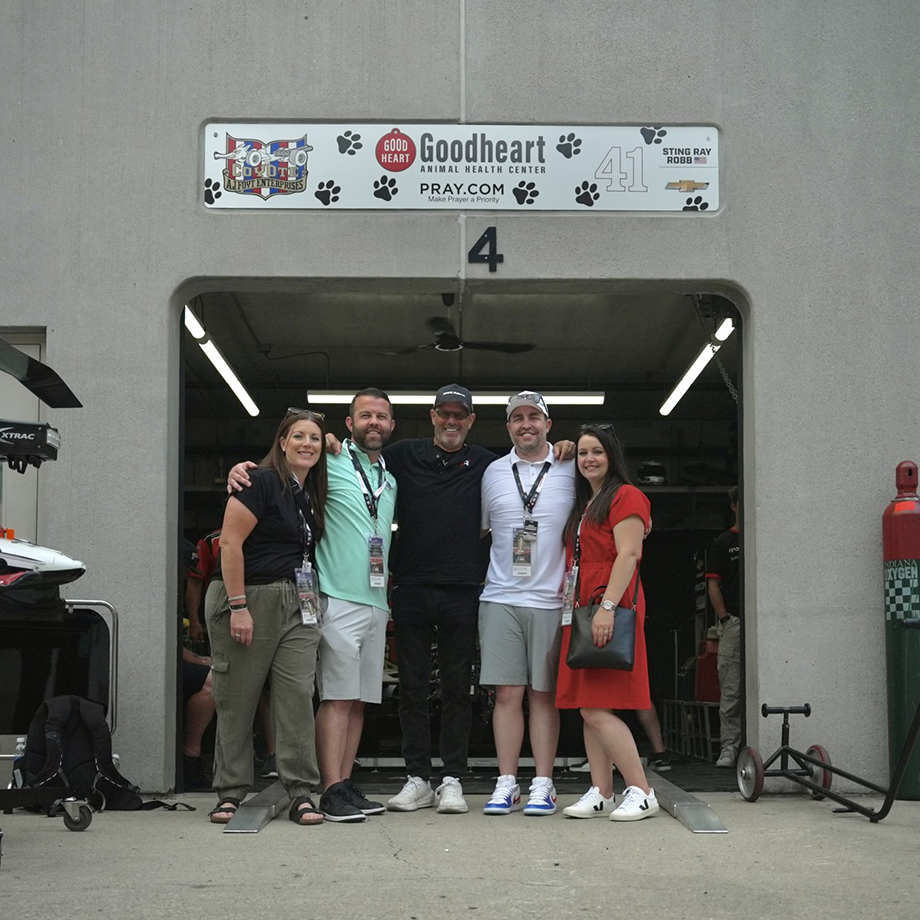 Blake Simmons with a customer at the entrance to #41 Indy Car Driver, Sting Ray Robb.